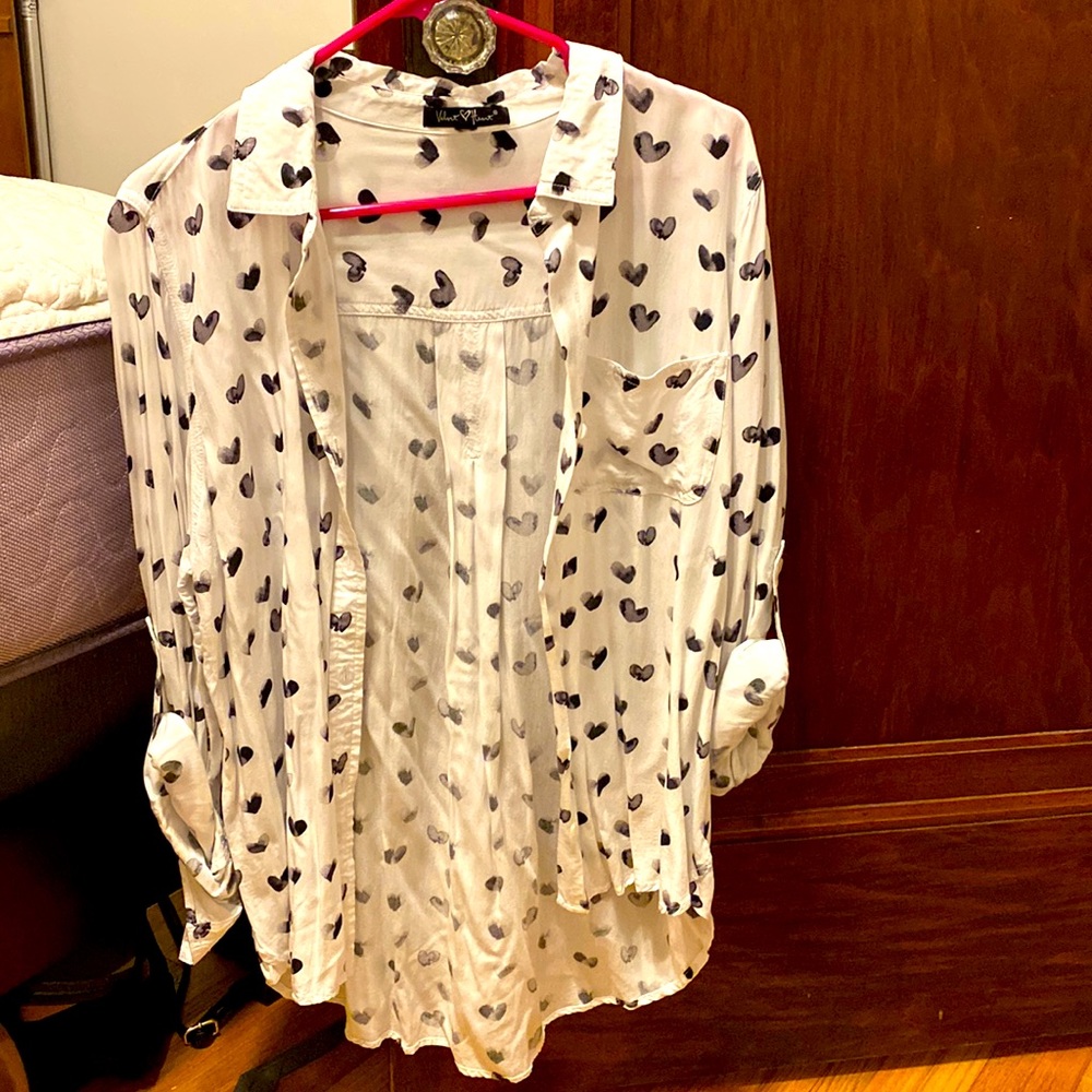 This white blouse with black hearts. The brand is velvet heart!